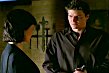 Angel invites Rebecca to sit while he fetches glasses
