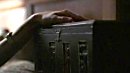 Eve fondles the box